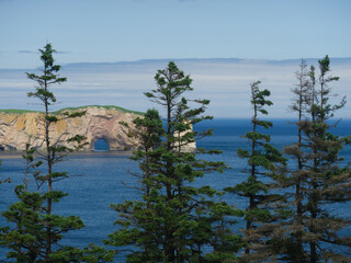 Perce Rock on the Gaspe Peninsula seen from an overlook looking out over the bay and the rock