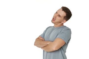 portrait of young happy man winking looking at the camera on white background