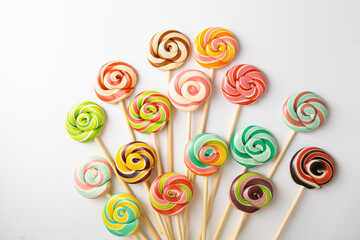 Set of colored caramel candies on sticks lollipop swirl - 712649884
