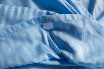 wrinkled blue striped bed linen - 712650462