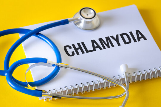 Chlamydia (Chlamydia Trachomatis) Conceptual word Chlamydia in doctor's notebook. Health concept, Bacteria causing urinary tract infection, Sexually transmitted disease, doctor stethoscope 