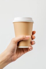 a woman hand holding a paper glass of coffee isolated on white background