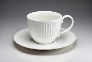Stylish porcelain cup on a white saucer, radiating elegance and refinement.