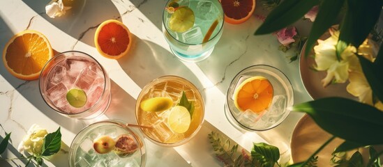Trendy summer alcoholic cocktails with retro style, served in sunlight from above. - obrazy, fototapety, plakaty