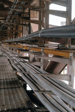 Rows of cable on a cable overpass. Outdoors industrial conduit corridor. Busbar gallery.