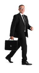 Mature businessman with briefcase walking on white background