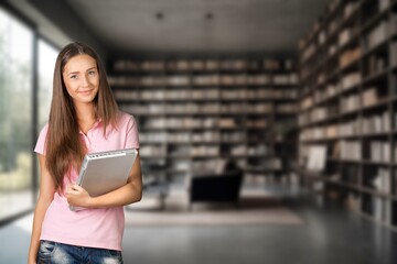 Young woman student in university library