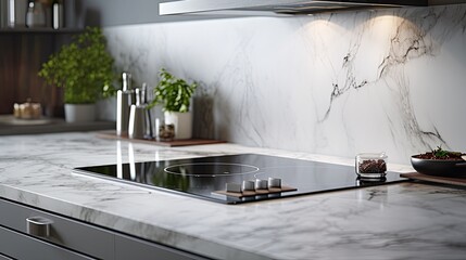 the induction cooktop on a marble countertop in the modern kitchen of a contemporary home, featuring an oven and cabinets, with a composition or scene in a minimalist modern style.