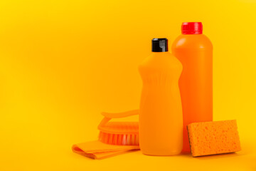 Cleaning service concept.Home cleaning product on a color background. Bucket with household chemicals. cleaning supplies for home or office space.Early spring regular cleaning. Copy space