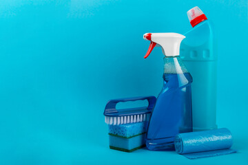 Cleaning service concept.Home cleaning product on a color background. Bucket with household chemicals. cleaning supplies for home or office space.Early spring regular cleaning. Copy space