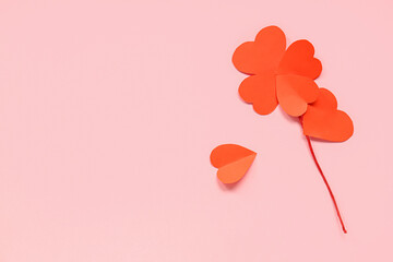 Composition with paper hearts on pink background. Valentine's day celebration