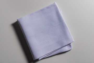 Top view of folded light blue napkin