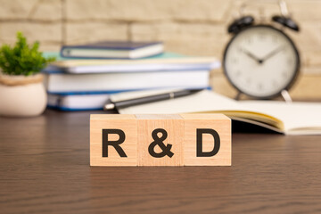 r and d - word concept from wooden blocks. Concept: Illustrating an innovative workspace where...