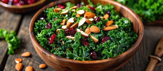 Foto op Plexiglas Nutritious kale salad with almonds and cranberries. © AkuAku