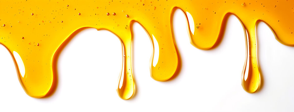 Horizontal image of honey drips on a white background