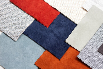 Scraps of colorful upholstery fabric in  different colors. Top view of the linen fabric