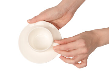 Female hand holding coffee cup and saucer isolated on white background.