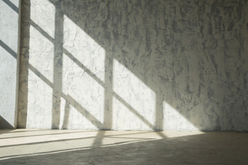 Drawing a shadow from a window on a concrete wall and floor.