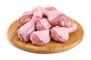 Raw chicken drumsticks, isolated on white background.