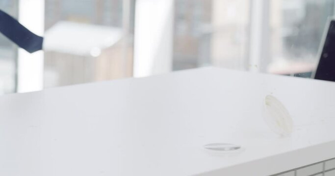 Angry businessman, hands and throw laptop off desk for fault, slow or system failure at office. Closeup of frustrated man or employee throwing computer in destruction or violence at workplace