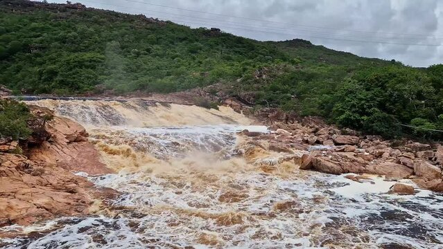 Donana Waterfall in Paraguassu River with dark waters due to iron ore in Andarai, Chapada Diamantina, Bahia in Brazil