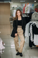 A person posing in a clothing stor 5788e.