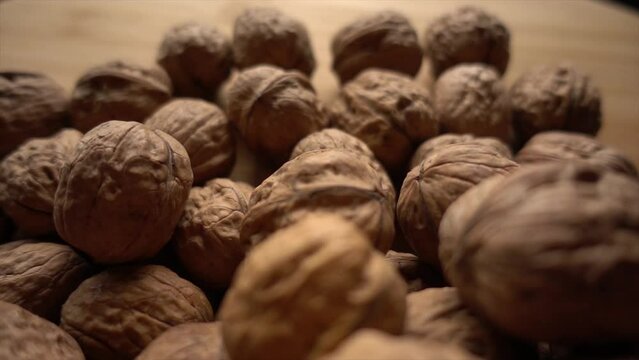 Walnuts. Camera slowly moves up to show close-up of beautiful walnuts