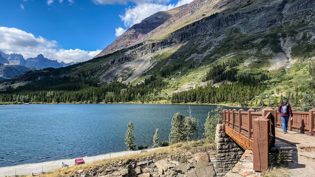 Woman Hiking around Swiftcurrent Lake in Many Glacier Region of Glacier National Park