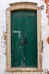 Antique wooden door painted in green