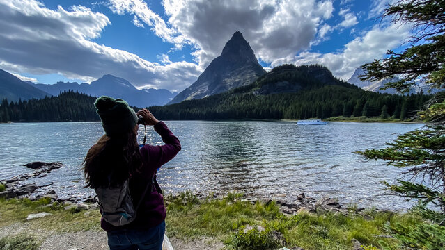 Woman Hiking around Swiftcurrent Lake in Many Glacier Region of Glacier National Park