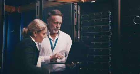 Server room, hand and laptop typing with discussion, information technology and online workplace. Datacenter, employees and administrator with communication to store or power computer hardware system