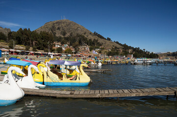 Fototapeta na wymiar leisure boats anchored at pier on Lake Titicaca