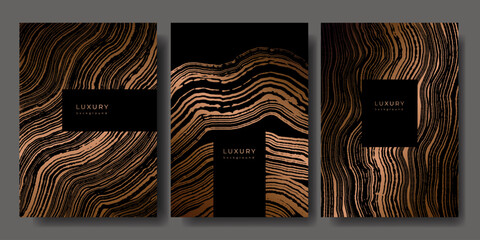 Set of templates. Luxury golden background with wood annual rings texture. Banner with tree ring pattern. Stamp of tree trunk in section. Wooden concentric circles. Black and bronze marble background © Morena