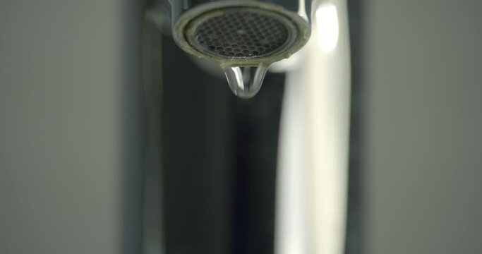 Dripping faucet / Center of frame