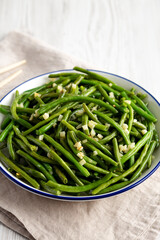 Homemade Asian Garlic Green Beans on a Plate, side view.
