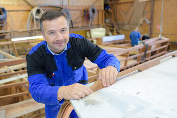 Fototapeta premium smiling craftsman during his day at work