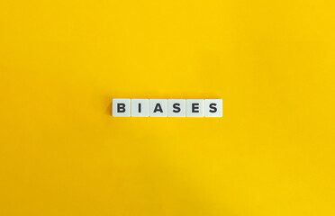Biases Word on Block Letter Tiles on Flat Yellow Background. Minimalist Aesthetics.