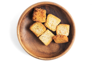 delicious crispy fried croutons in wooden bowl isolated on white