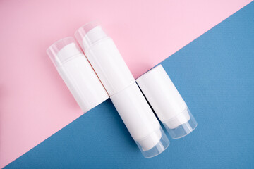 Container for cream, shampoo, toiletries, spa. Unbranded white plastic bottles. Bottle with a dispenser for cosmetic products. Skin care and beauty concept. Mockup style, copy space
