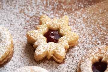 Closeup of a Linzer Christmas cookie filled with marmalade