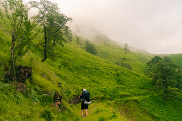 Obraz premium Hiker on countryside landscape in the Pyrenees, Pyrenees in France. hrp trail, gr10