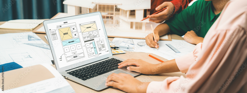 Poster cropped image of interior designer team discuss the material color while laptop displayed website wi