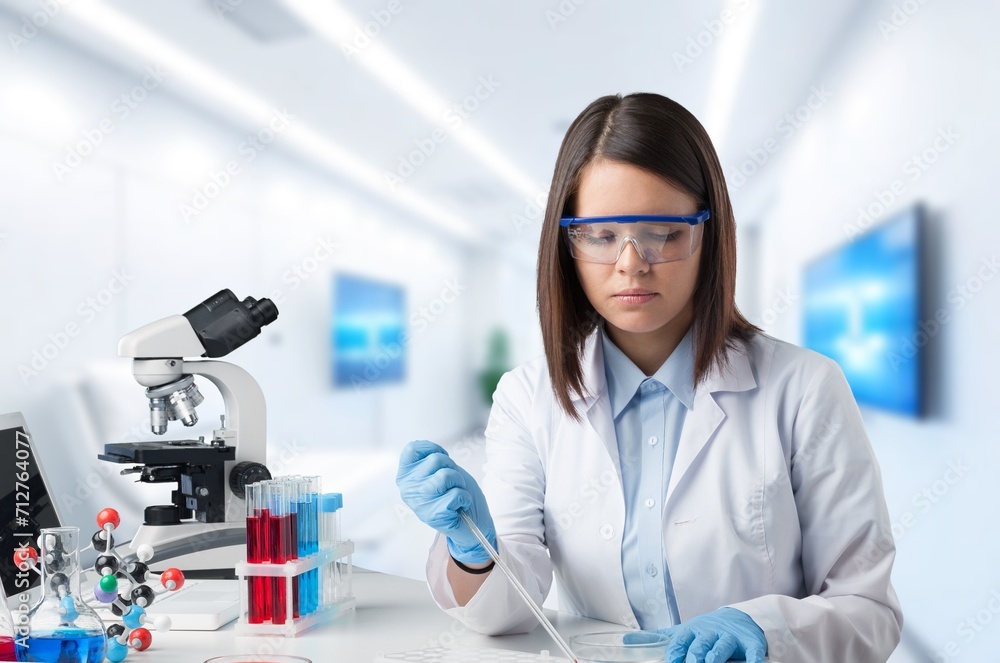Poster technician worker testing sample in the lab.