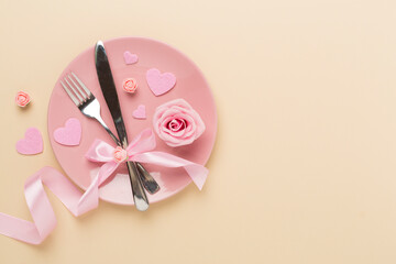 Festive table setting for Valentine's Day on color background, top view