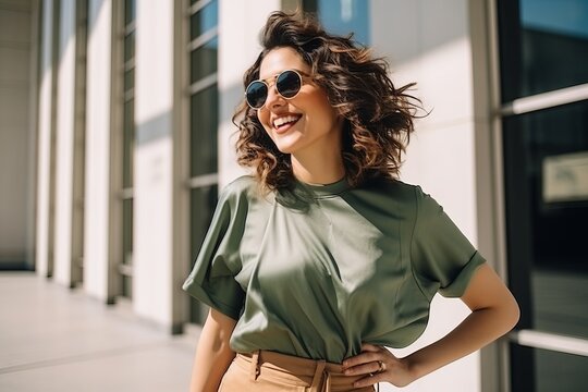 Portrait of beautiful young woman with long curly hair and sunglasses.