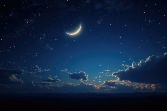 A beautiful, clear night sky with a crescent moon and stars