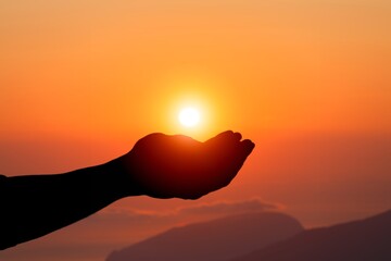 Silhouette of hand prayer person worship God with sunrise