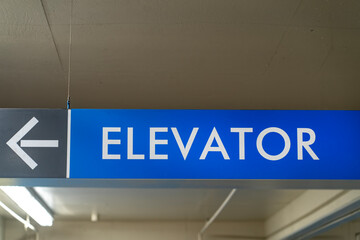 Elevator sign with an arrow