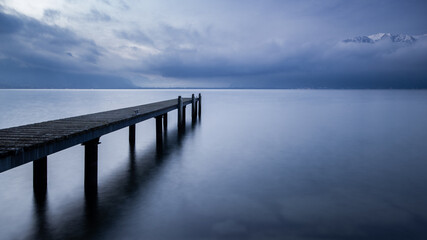 Fototapeta na wymiar Pier on a calm swiss lake