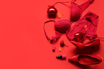 Composition with sexy lingerie, shoes and heart-shaped balloons on red background. Valentine's Day celebration
